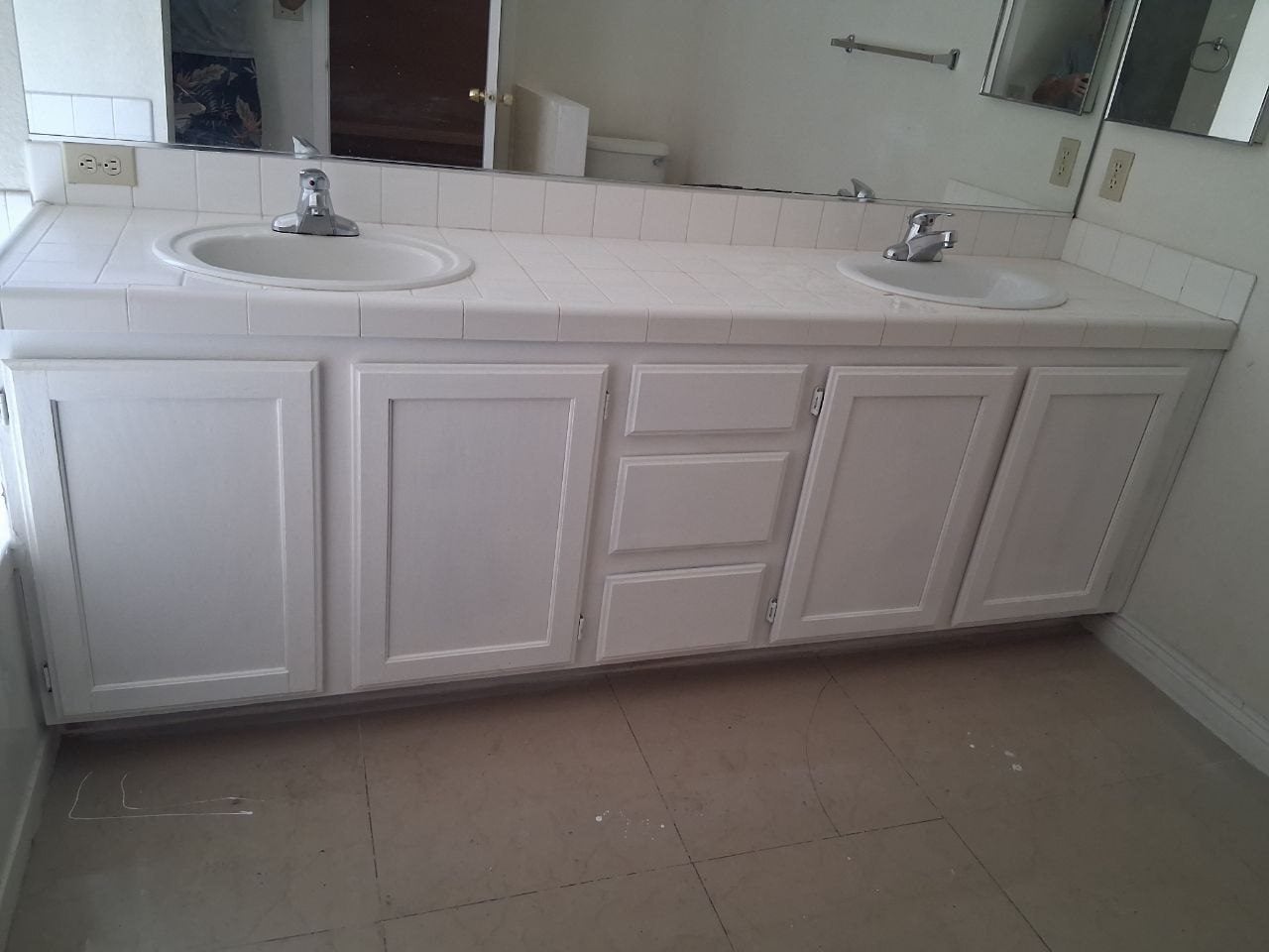 White double vanity with two sinks after the repair