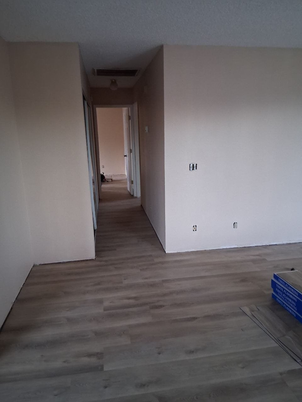 Hallway with a new gray plank vinyl floor