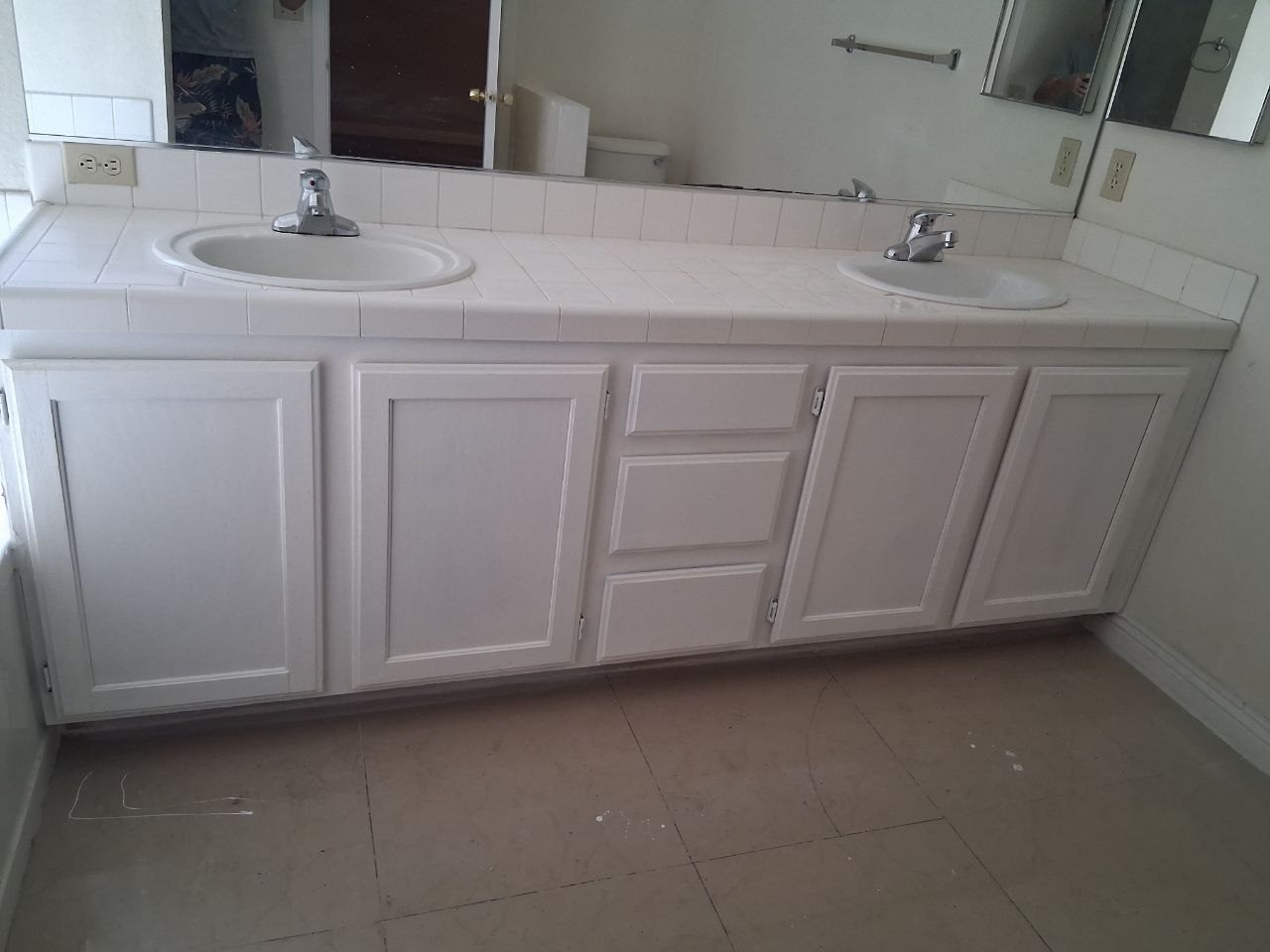 White double vanity with two sinks after the repair